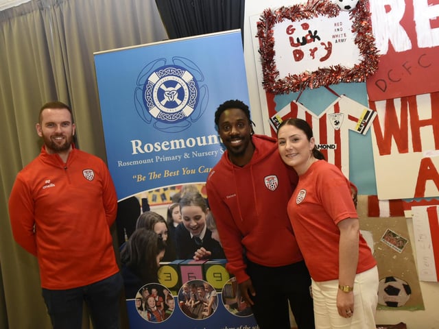 Derry City Football Player Kevin dos Santos with Rosemount Primary School Principal Aoife Meenan and P7 teacher Rory Collins.