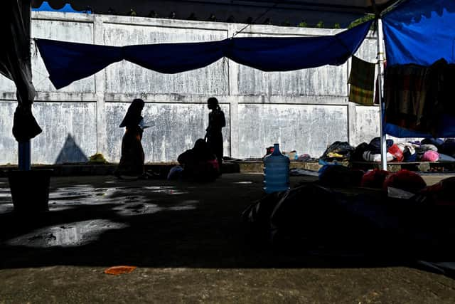 Rohingya refugees gather at a temporary camp, at a port in Sabang island, Indonesia's Aceh province on December 18, 2023. (Photo by CHAIDEER MAHYUDDIN / AFP) (Photo by CHAIDEER MAHYUDDIN/AFP via Getty Images)