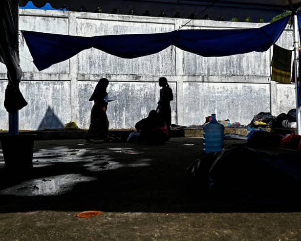 Rohingya refugees gather at a temporary camp, at a port in Sabang island, Indonesia's Aceh province on December 18, 2023. (Photo by CHAIDEER MAHYUDDIN / AFP) (Photo by CHAIDEER MAHYUDDIN/AFP via Getty Images)