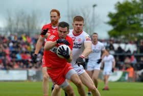Derry’s Benny Herron evades a tackle from Tyrone's Cathal McShane during last season's' Ulster Championship clash.  Photo: George Sweeney. DER2218GS – 001