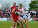 Derry’s Benny Herron evades a tackle from Tyrone's Cathal McShane during last season's' Ulster Championship clash.  Photo: George Sweeney. DER2218GS – 001