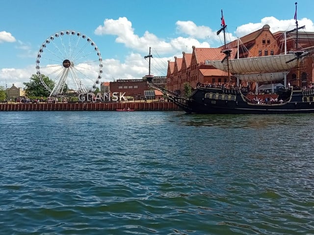The Czarna Perła (Black Pearl) sails up the Motlawa in Gdansk.