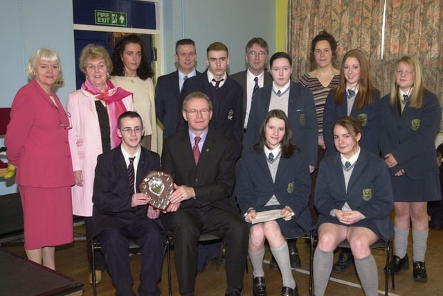 Pupils from St Peter's High School and Thornhill College receive awards from former Education Minister Martin McGuinness at Key Stage 4 of Derry Schools and Colleges Poetry Awards.