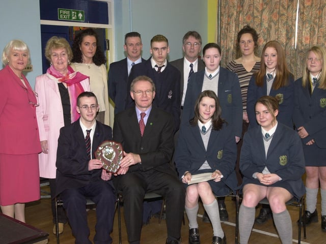 Pupils from St Peter's High School and Thornhill College receive awards from former Education Minister Martin McGuinness at Key Stage 4 of Derry Schools and Colleges Poetry Awards.