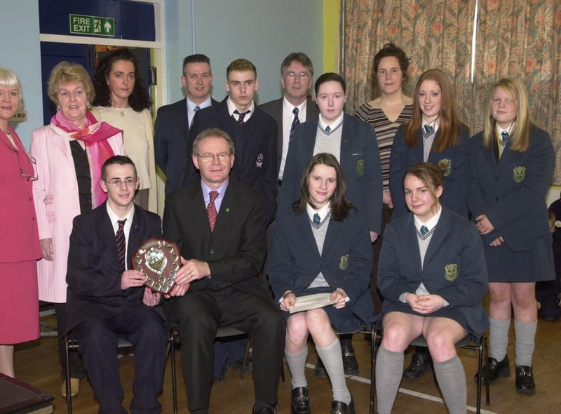 Pupils from St Peter's High School and Thornhill College receive awards from former Education Minister Martin McGuinness at Key Stage 4 of Derry Schools and Colleges Poetry Awards.