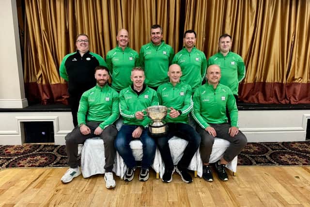 Danny celebrates last year's Derry senior championship managers Gary Hetherington and Kevin Brady and the rest of the Newbridge backroom team