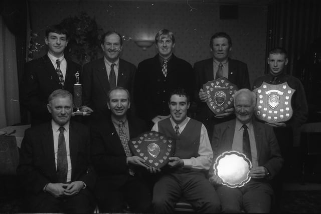 Charlie Collins, Highland Radio, seated, second from left, presenting the Malin G.F.C. Senior Player of the Year Award, Patrick Kelly. Included at front, from left, are Patrick McLaughlin, chairman, and Clement Sweeney (Hall of Fame Award). Back, from left, are Patrick J. Doherty (Minor Player), John Friel, chairman, Co. Donegal GAA Minor Board. Donegal 'keeper, Paul Callaghan, Patrick Houlton, club person, and Ronald McDaid (Reserve Player).