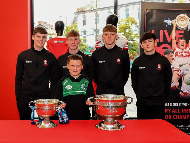 Connell Davidson pictured with members of Derry's All-Ireland Minor Champions team at O'Neill's Superstore last week. Photo: George Sweeney