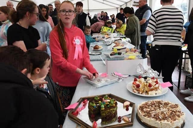 Sampling cake at last year's Muff Féile. Photo: George Sweeney