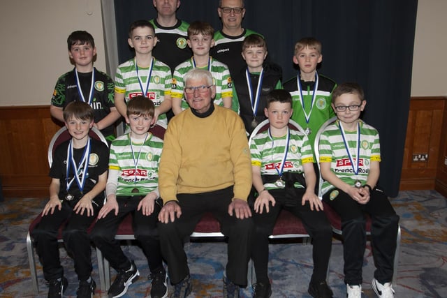 John ‘Jobby’ Crossan pictured with the Top of the Hill Celtic FC U10 team who were Summer Premier runners-up during the Annual Awards in the City Hotel on Friday night last. Included are coaches Martin Doherty and Brendan Elliott.