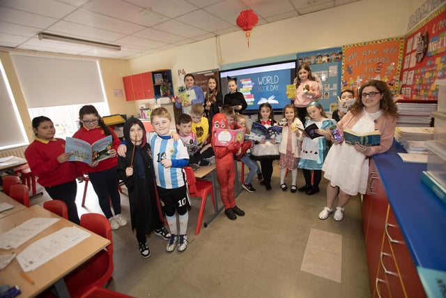 Mrs O Doherty and her class taking some time to share their favourite books during World Book Day at Steelstown PS.