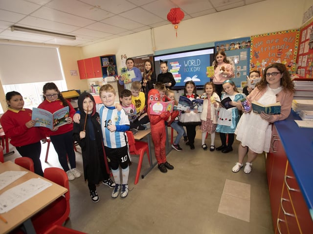 Mrs O Doherty and her class taking some time to share their favourite books during World Book Day at Steelstown PS.