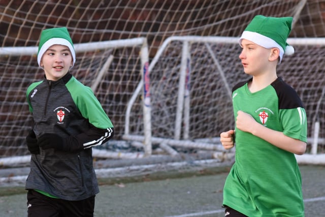 Caolan and Kayden have time for a chat during Tuesday's Santa's Run at Magee College Grounds.