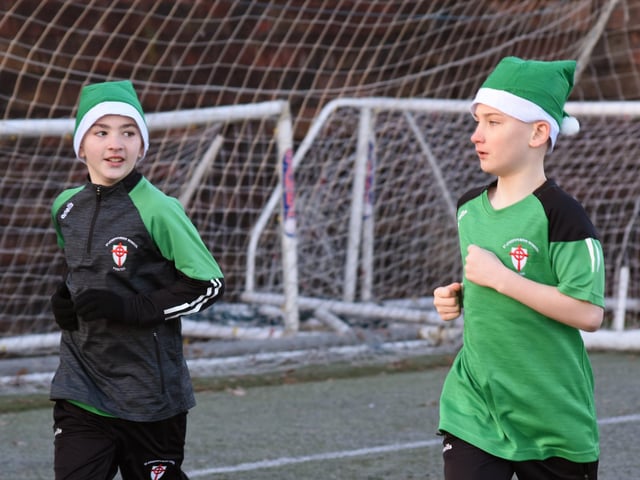 Caolan and Kayden have time for a chat during Tuesday's Santa's Run at Magee College Grounds.