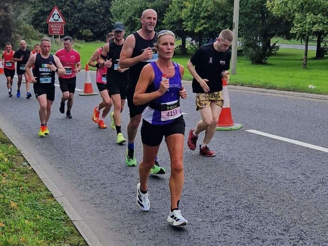 Springwell's leading lady at Waterside Half Marathon, Catherine Pinkerton prepares to climb Foyle Bridge