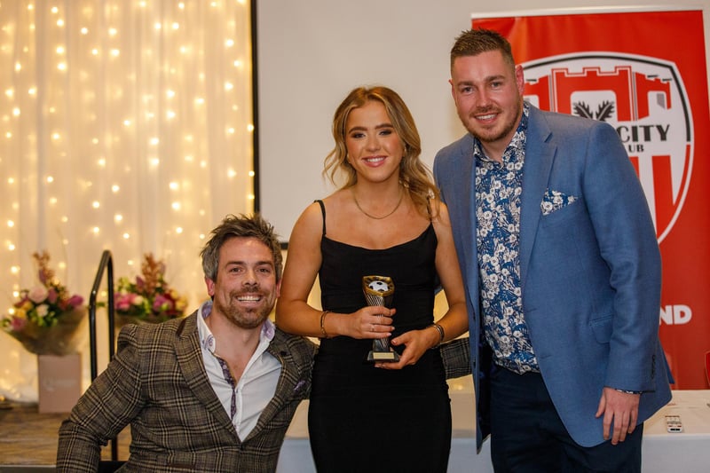 Most improved player, Katie Hargan receives her award from manager Paul Dixon and first team coach Pete Mitchell.