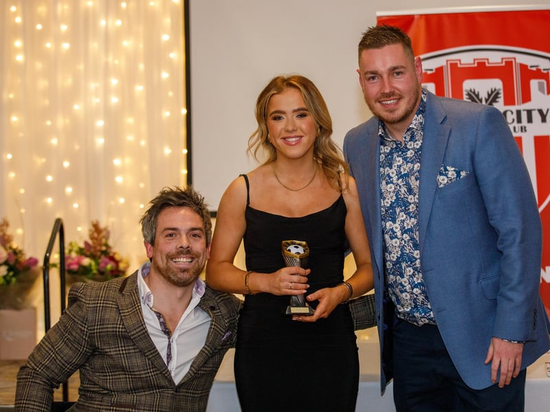 Most improved player, Katie Hargan receives her award from manager Paul Dixon and first team coach Pete Mitchell.