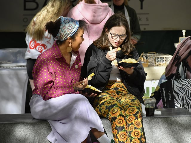 Revellers enjoy the sunshine, the food and the music in Guildhall Square during the Jazz Festival.  Photo: George Sweeney