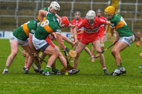 Derry and Kerry players battle for possession of the sliothar in Celtic Park. (Photo: George Sweeney).