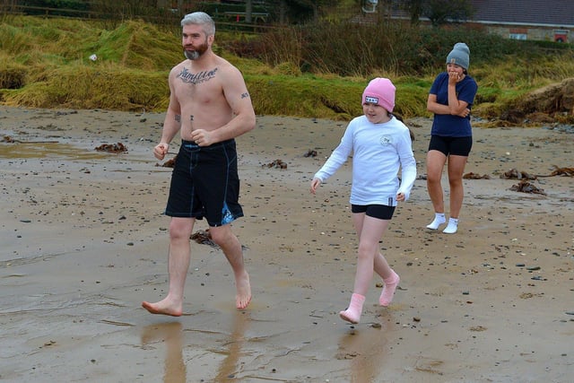 Some of the swimmers taking part in the annual ARC Fitness New Year's Day Charity Swim at Lisfannon beach.  Photo: George Sweeney. DER2301GS  04