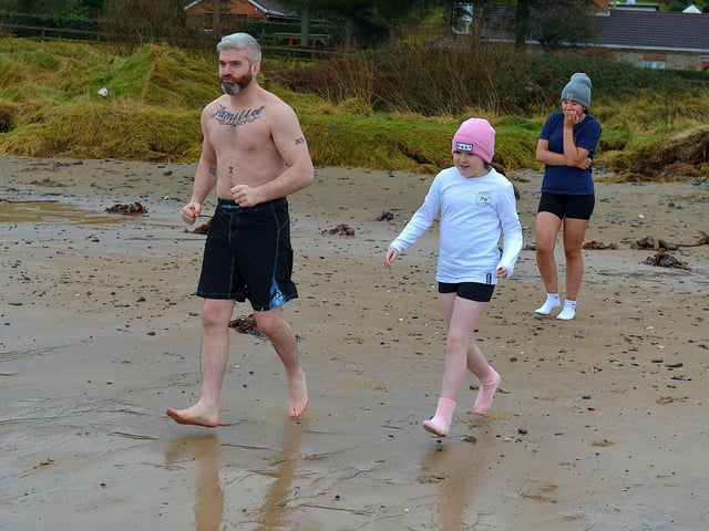 Some of the swimmers taking part in the annual ARC Fitness New Year's Day Charity Swim at Lisfannon beach. Photo: George Sweeney. DER2301GS 04