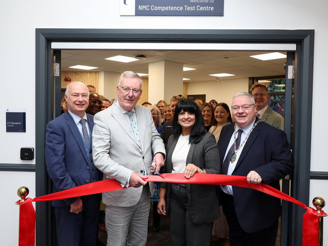 Paul Bartholomew, Vice Chancellor at Ulster University, Health Minister, Mike Nesbitt, Professor and Shahneela Grygiel, Assistant Director of Registration and Revalidation at the Nursing and Midwifery Council and Deputy Mayor of Derry City and Strabane District Council, Darren Guy cutting the ribbon at the Official Launch of the New Nursing Competence Test Centre located at Foyle House in Derry.