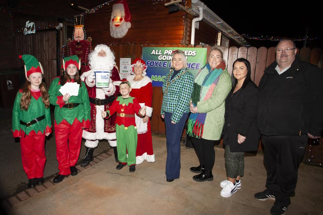 The Mayor of Derry City and Strabane District Council, Sandra Duffy pictured at the Amelia Court Christmas Lights Switch-On on Thursday night last. Included on left are Santa Claus, Mrs. Claus and their elves and, on right, Ailbhe McDaid, Fundraiser, Foyle Hospice, Michaela Harkin and Martin Carr, residents, Amelia Court. All monies raised are gong to the Foyle Hospice and MacMillan. (Photos: Jim McCafferty Photography)