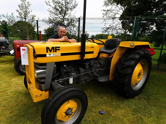 Neil McGonagle pictured beside his MF20 Industrial Massey tractor at the Muff Vintage Show, held in the Community Park on Sunday. Photo: George Sweeney.