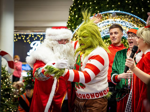 Derry, Northern Ireland. 7 November 2025. Santa and the Grinch share the stage at Foyleside Shopping Centre, switching the Christmas lights back on to applause from the crowd. Credit: Aodhan Roberts. : Joyous scenes as Santa arrives at Foyleside Shopping Centre and the festive lights are turned on. Photos: Aodhán Roberts.