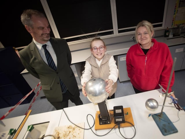 Oakgrove's Mr. Gavan Duffy keeps an eye on 'hairaiser' Safiya Donnell, Oakgrove PS P7 pupil during Tuesday's Open Day.