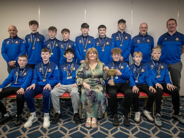 The Deputy Mayor Niree McMorris presenting Limavady United U-14s with their trophies at the Annual D&D Youth FA awards on Friday night. Included are coaches  Rich Stewart, Alwyn Hunt and Ali White. (Photos: Jim McCafferty Photography)