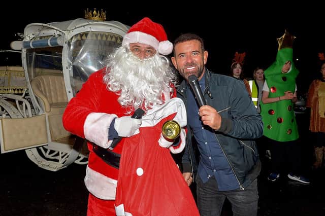 Derry’s own Micky Doherty pictured with Santa at the Creggan Community Collective, Cromore Gardens, on Friday evening last. DER2249GS – 33