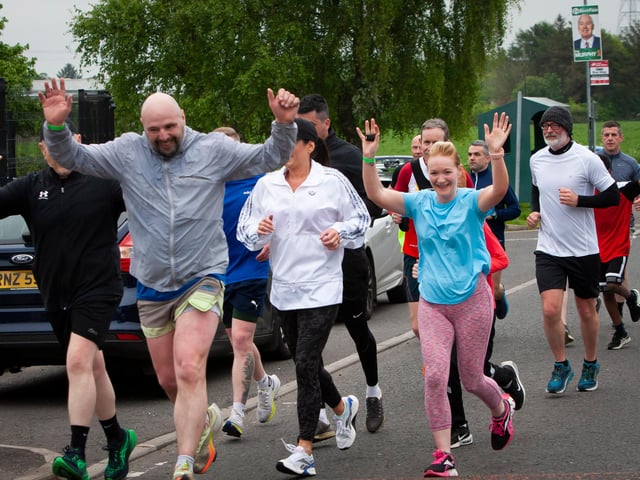 Terry Og Crossan leads a group of jubilant parents along the home straight on Friday.