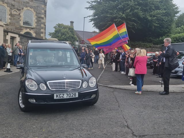 Nell McCafferty's funeral cortege makes it way from the grounds of the Long Tower.