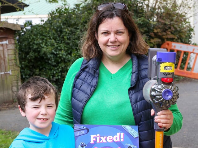 Jacqueline Whoriskey and her son Emmett with her fixed vacuum cleaner.