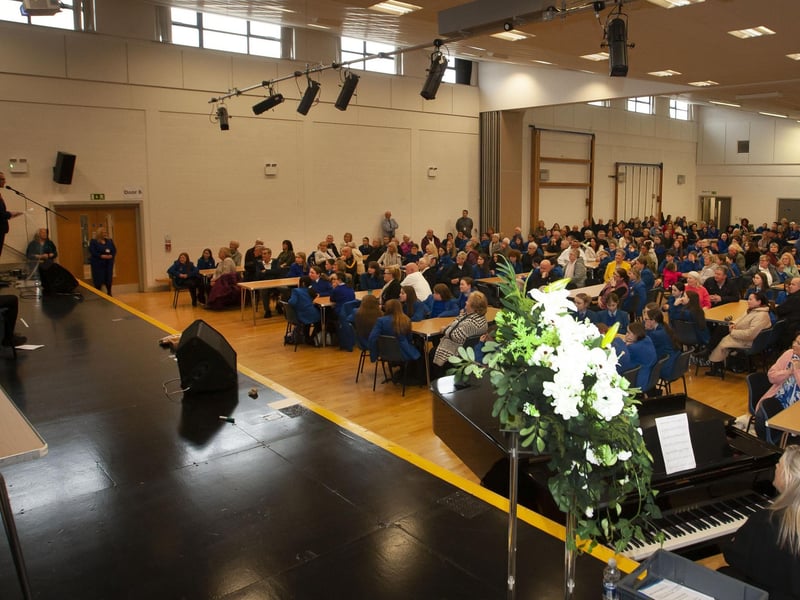 A packed assembly hall of Year 8 students and their grandparents are addressed by Princial, Mr. Brendan McGinn.