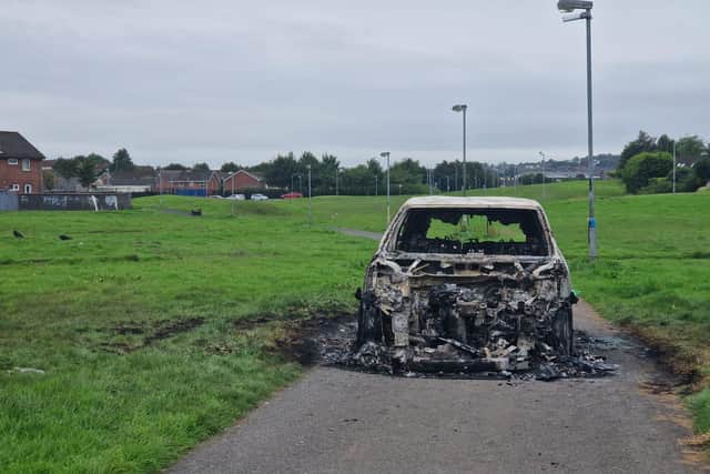 A car destroyed during public disorder in Galliagh.