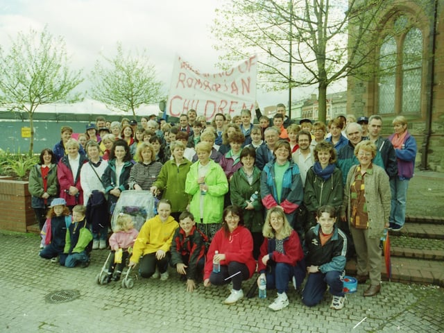 A sponsored walk in aid of relief for Romania setting off from the Guildhall.