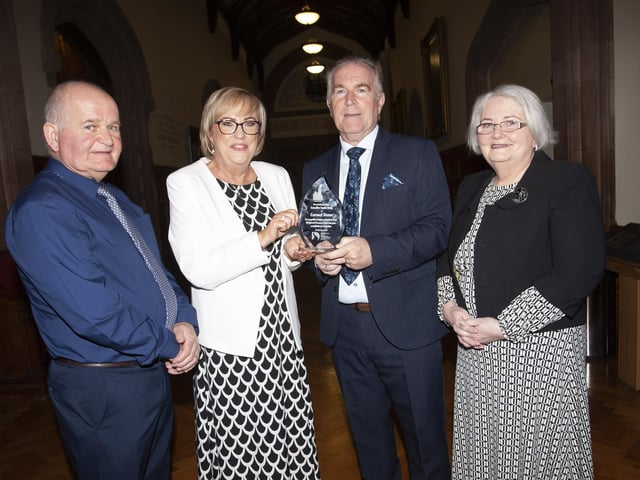 Ms Carmel Dunn pictured with family members.