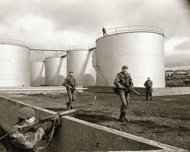 Army take over oil depots and garages.