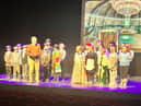 Gaelscoil Éadain Mhóir pupils on stage at Féile Scoildramaíochta Uladh.