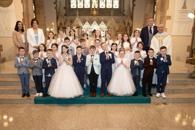 Children from Rosemount Primary School who received the Sacrament of First Holy Communion from Fr. Paul Farren at St. Eugene's Cathedral on Friday last. Included are Mrs. McSheffrey, Mrs Aisling McMenamin, teacher and Mr. Brady. (Photos: Jim McCafferty Photography)