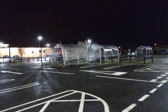 A damaged trolley canopy in Sainsbury's car park.