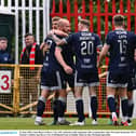 Liam Boyce of Derry City, left, celebrates with teammates after scoring at Richmond Park in Dublin.