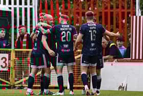 Liam Boyce of Derry City, left, celebrates with teammates after scoring at Richmond Park in Dublin.
