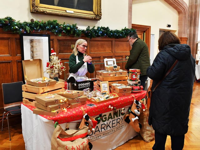 People browse the large range of gifts at the Guildhall Christmas Fair on Friday afternoon. Photo: George Sweeney / Derry Journal