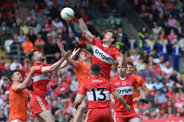 Derry's Brendan Rogers rises highest to punch home the Ulster Final's only goal in Clones on Sunday. (Photo: John Merry)