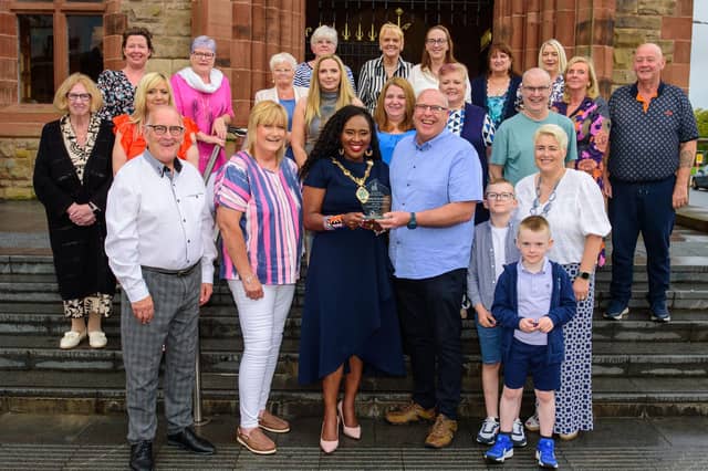 The Mayor Councillor Lilian Seenoi-Barr welcomed Slimming World Consultant Ivan Black and members of the Sliimming with Ivan group to the Guildhall with to recognise the fundraising efforts of the group for the Legenderry Relay for Life. So far they have raised £690,000 to help fight cancer. Picture Martin McKeown. 08.08.24