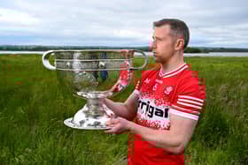 Emmett Bradley poses with the Sam Maguire Cup during this week's launch of the All-Ireland Series at Lough Beg in Derry. (Photo: Brendan Moran/Sportsfile)