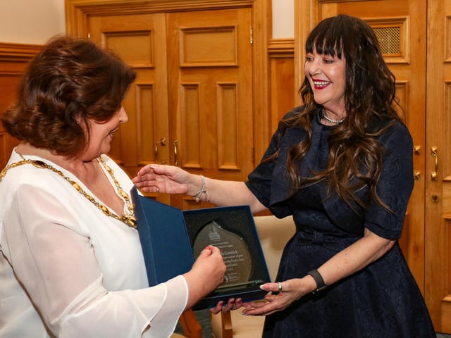 The Mayor of Derry, Councillor Patricia Logue, presenting a civic gift to Sharon McCormick at a reception in the Guildhall in appreciation of her contribution to improving peoples lives in the City and District.